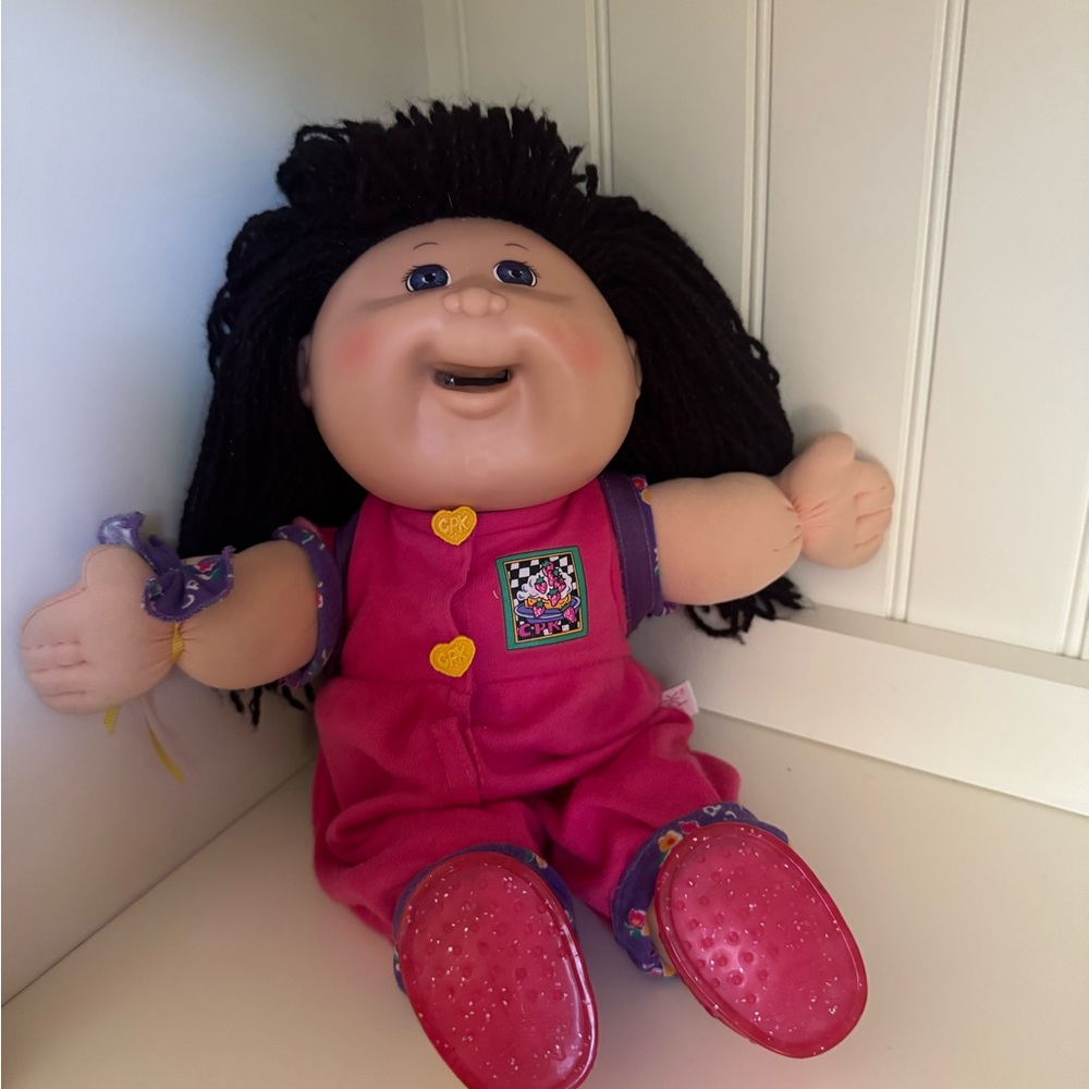Adorable Pink Doll with Black Hair